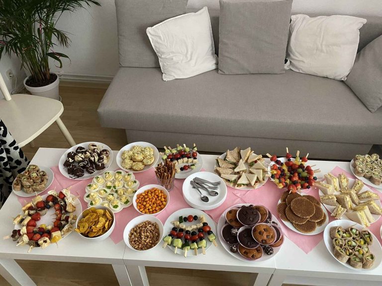 Baby shower spread featuring dishes from different countries